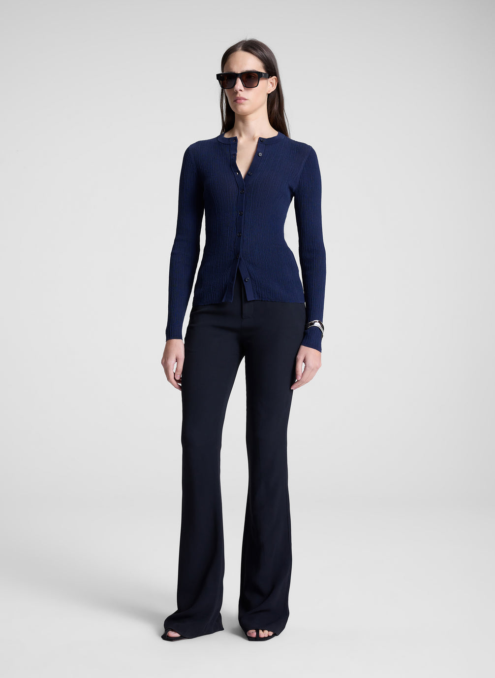 woman wearing navy blue cardigan an navy blue pants