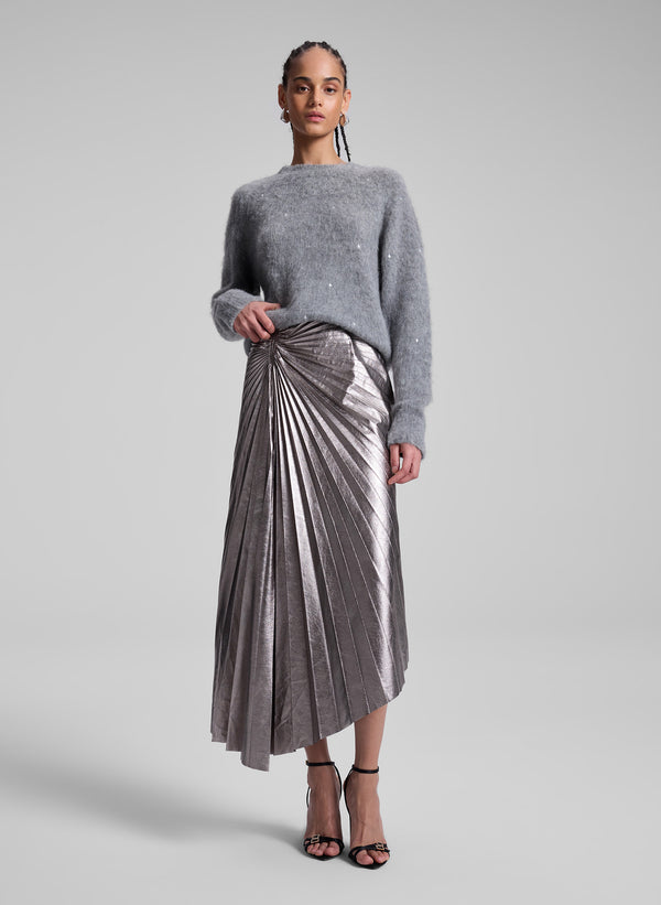 woman wearing grey sweater and silver midi skirt