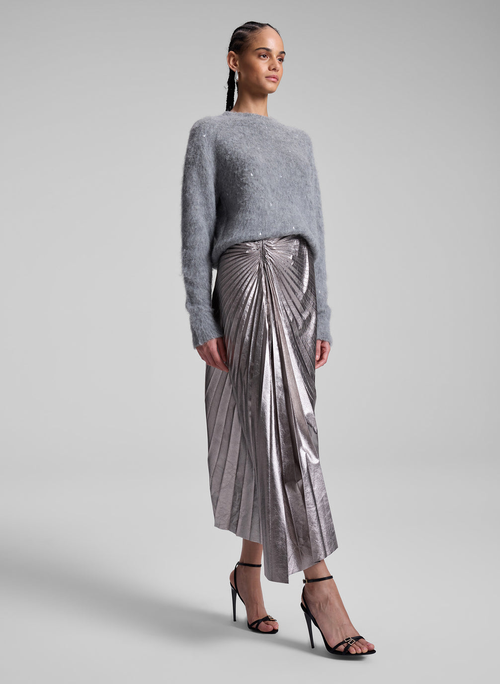 woman wearing grey sweater and silver midi skirt