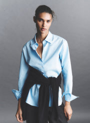 woman wearing blue button down shirt