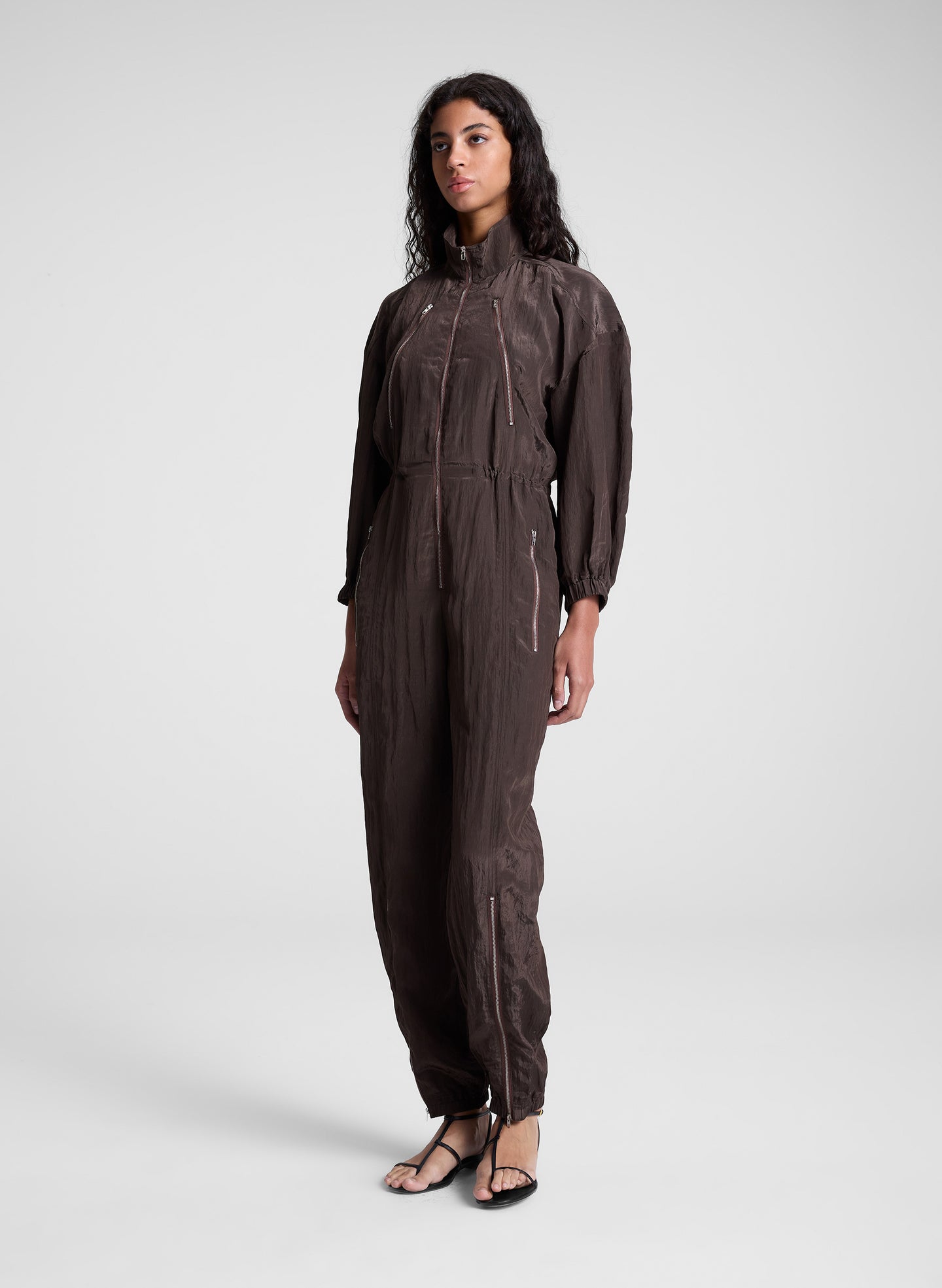woman wearing dark brown zip jumpsuit