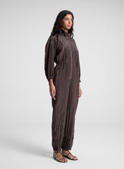 woman wearing dark brown zip jumpsuit