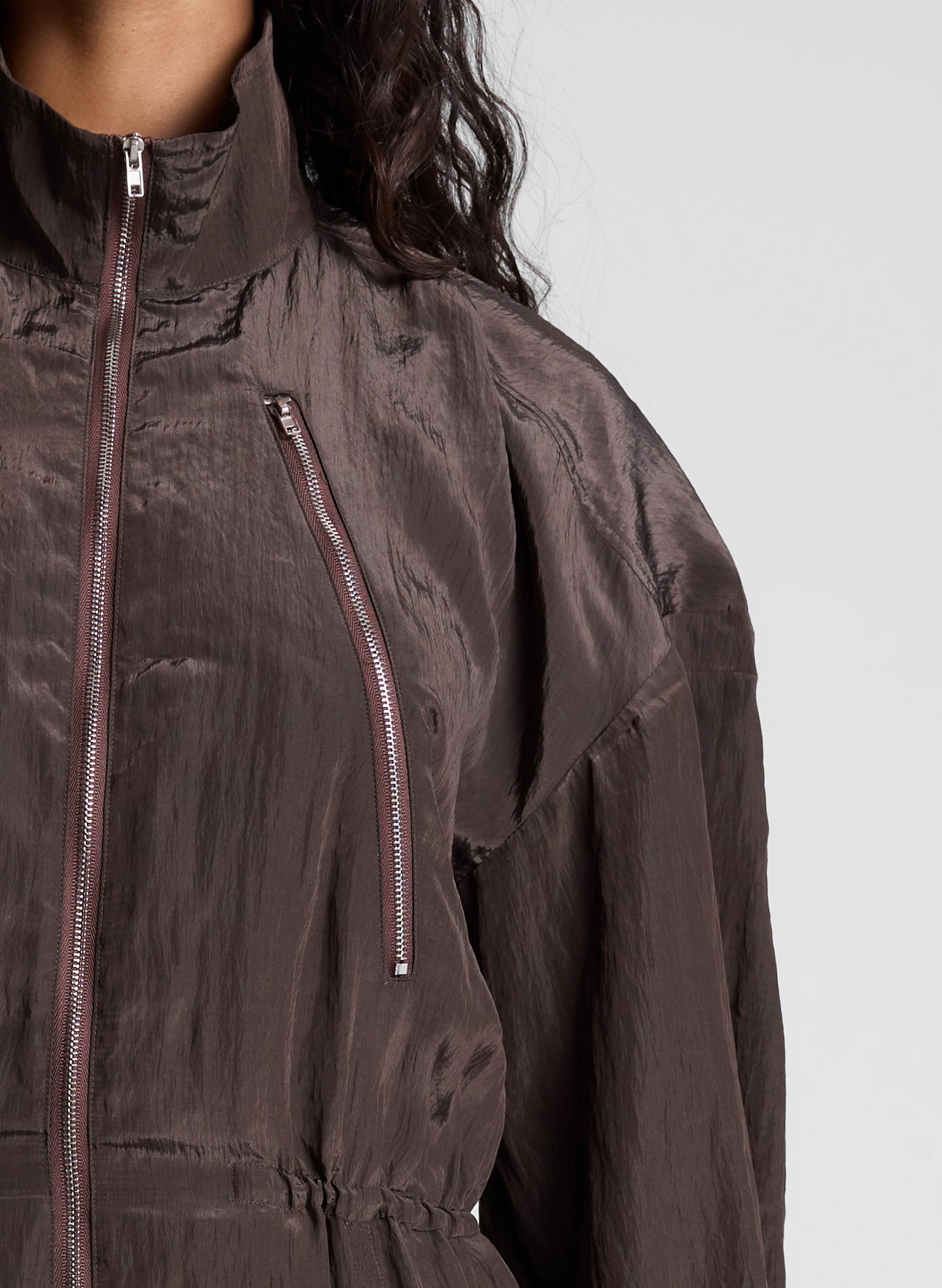 woman wearing dark brown zip jumpsuit