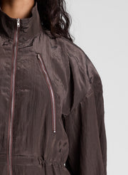 woman wearing dark brown zip jumpsuit