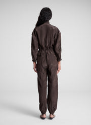 woman wearing dark brown zip jumpsuit