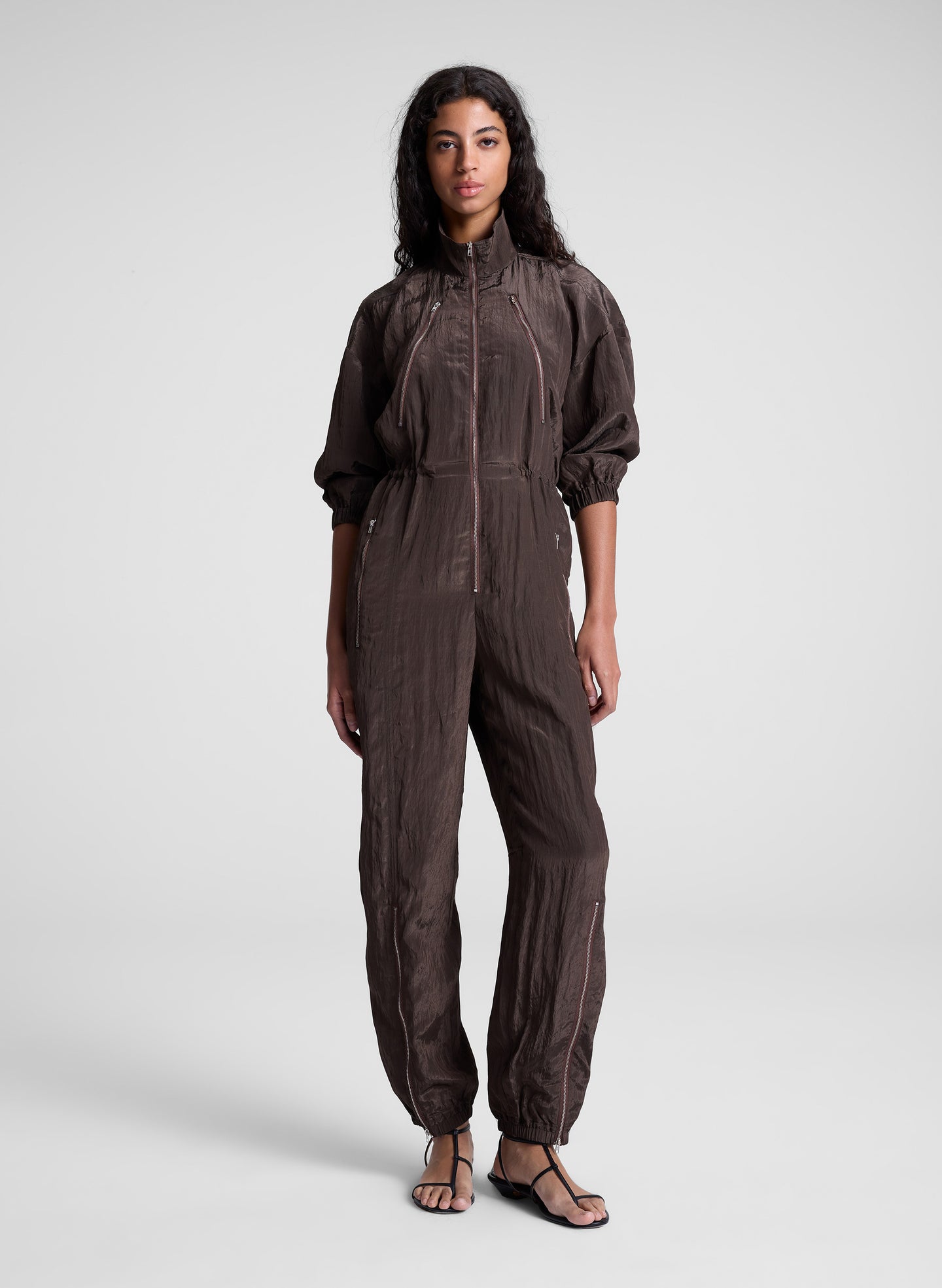 woman wearing dark brown zip jumpsuit