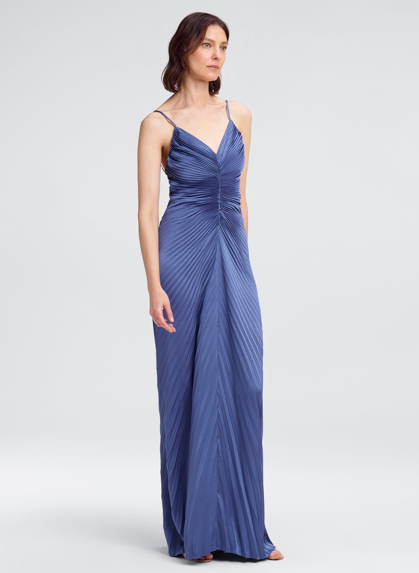 woman in blue pleated gown