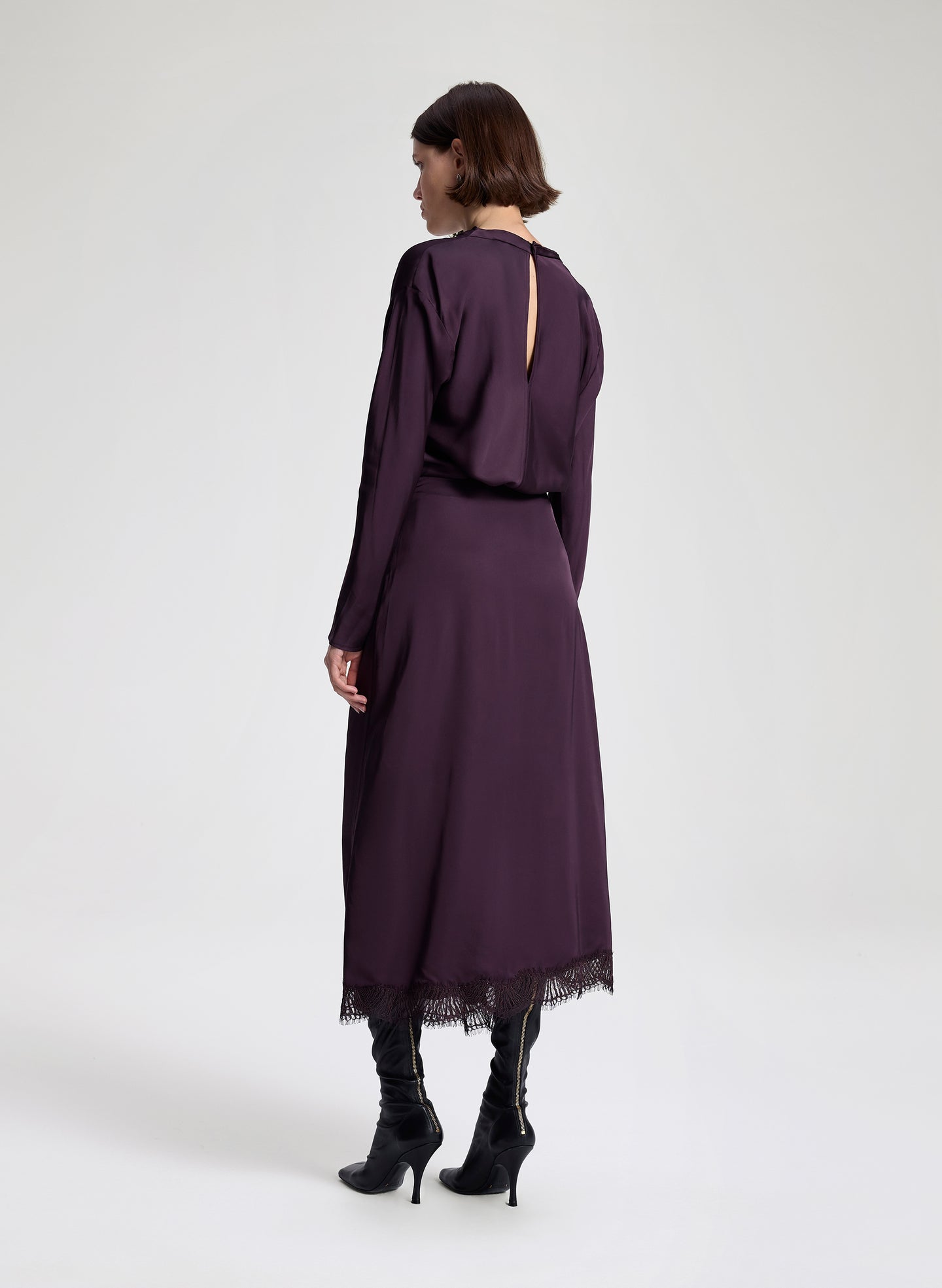 woman wearing purple top and purple midi skirt