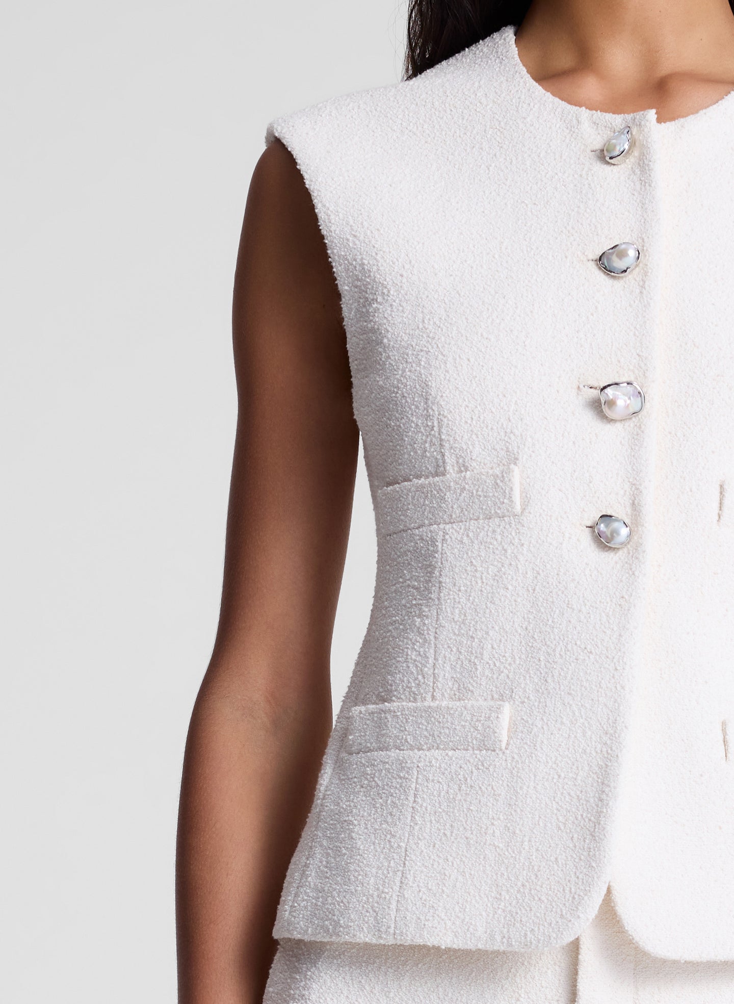 woman wearing white vest and matching short