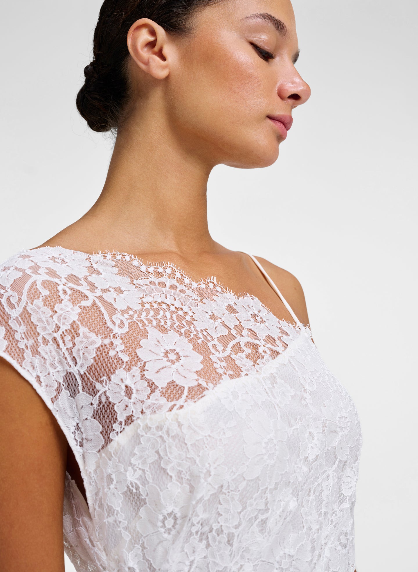 detail of cream lace gown