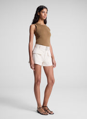 woman wearing brown tank top and beige shorts