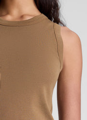 woman wearing brown tank top and cream shorts