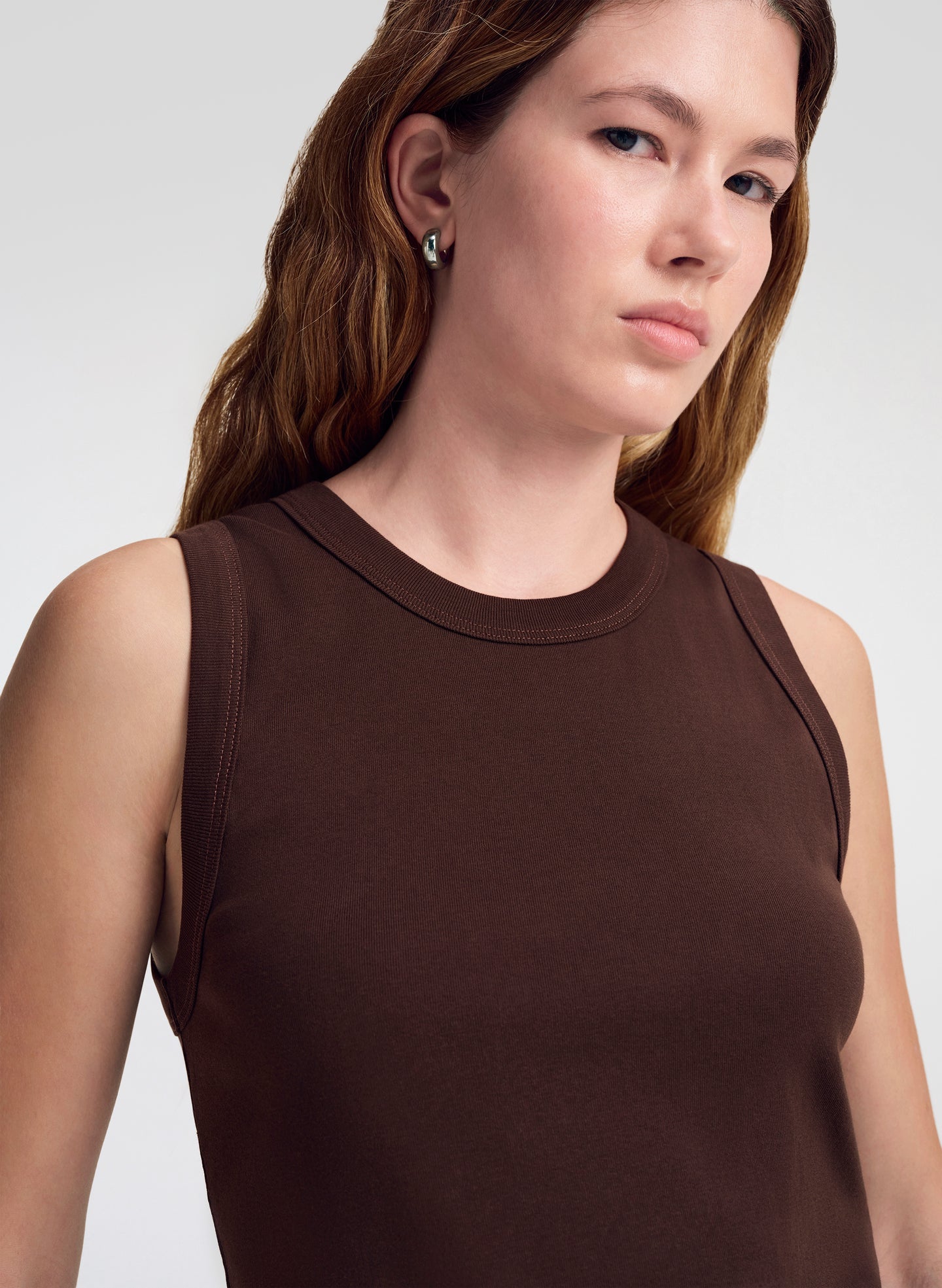 woman wearing brown tank top