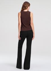 woman wearing brown tank top and black pants