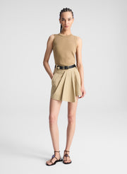 woman wearing beige tank and matching skort