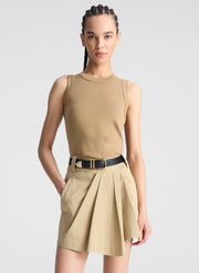 woman wearing beige tank top and beige skort