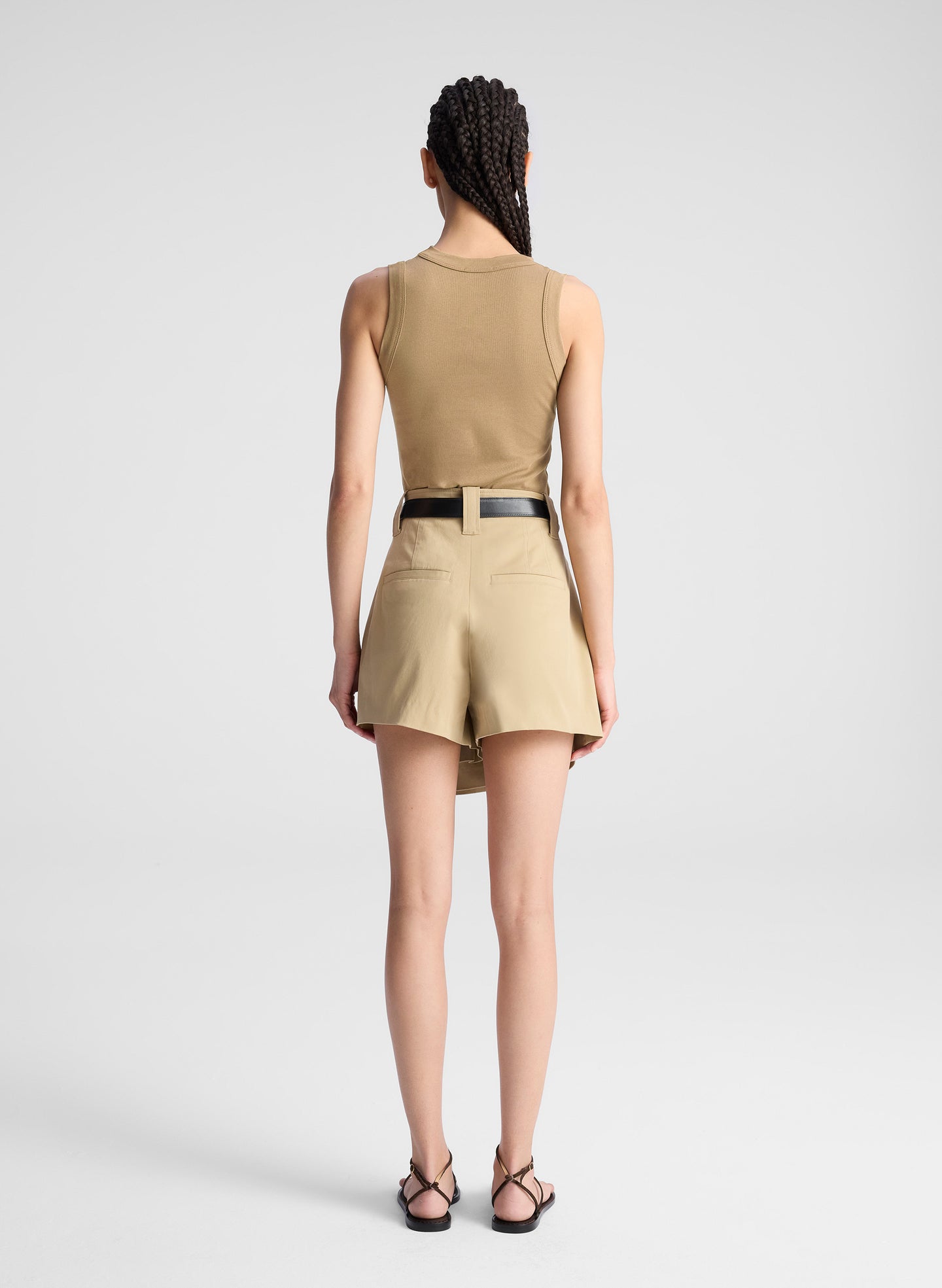 woman wearing beige tank and matching skort