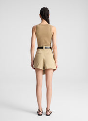 woman wearing beige tank and matching skort