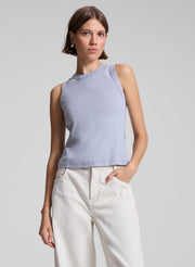 woman wearing grey tank top and white jeans