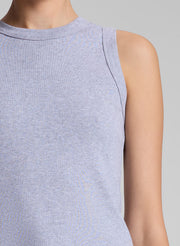 woman wearing grey tank top and white jeans