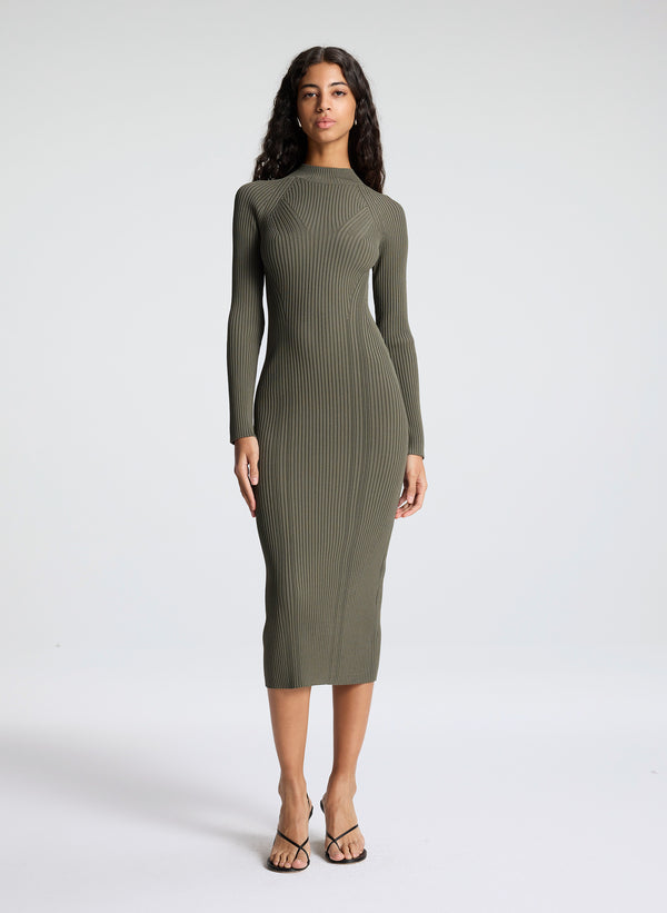 woman wearing green knit midi dress