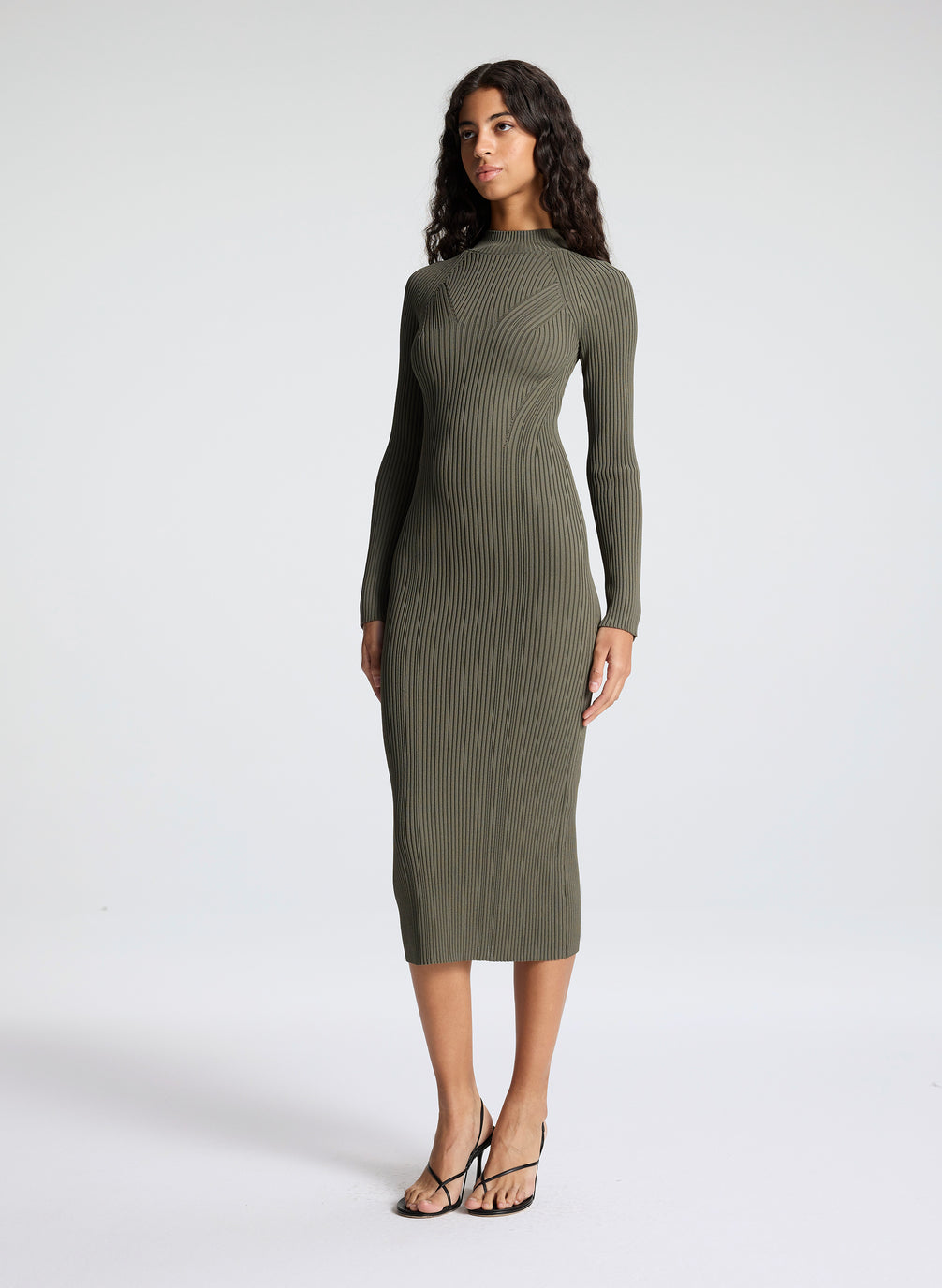 woman wearing green knit midi dress