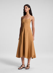 woman wearing brown sleeveless midi dress