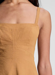 woman wearing brown sleeveless midi dress