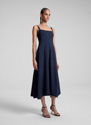 woman wearing navy blue midi dress