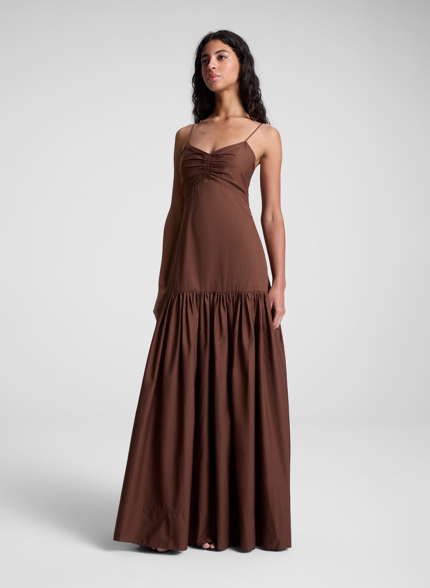 woman wearing brown maxi dress