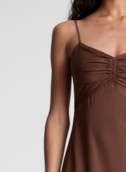 woman wearing brown maxi dress