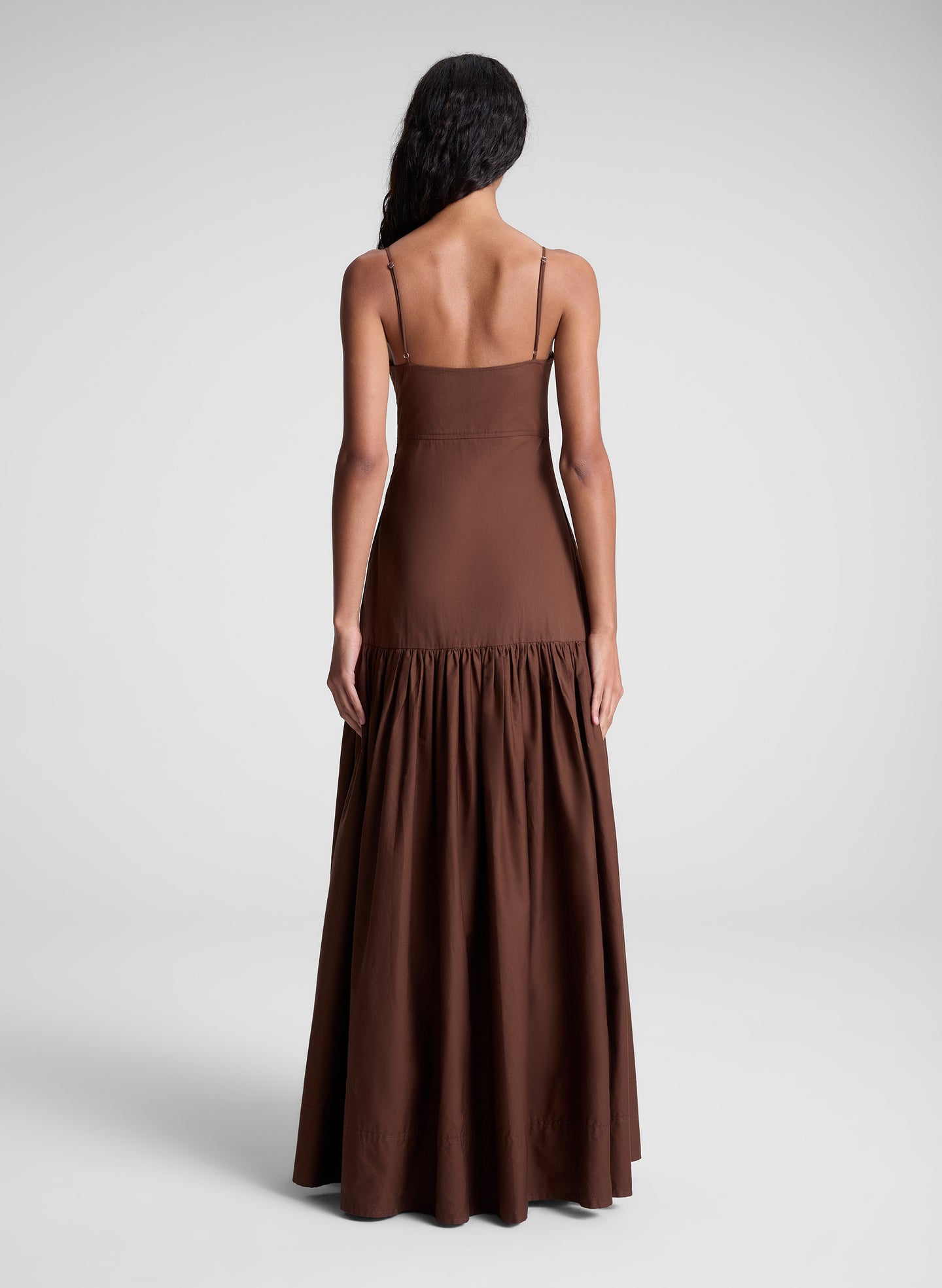 woman wearing brown maxi dress