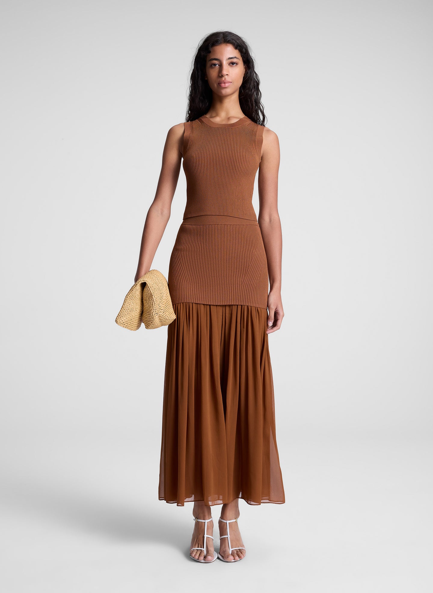 woman wearing brown top and skirt set