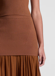 woman wearing brown top and skirt set