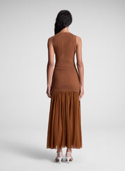 woman wearing brown top and skirt set