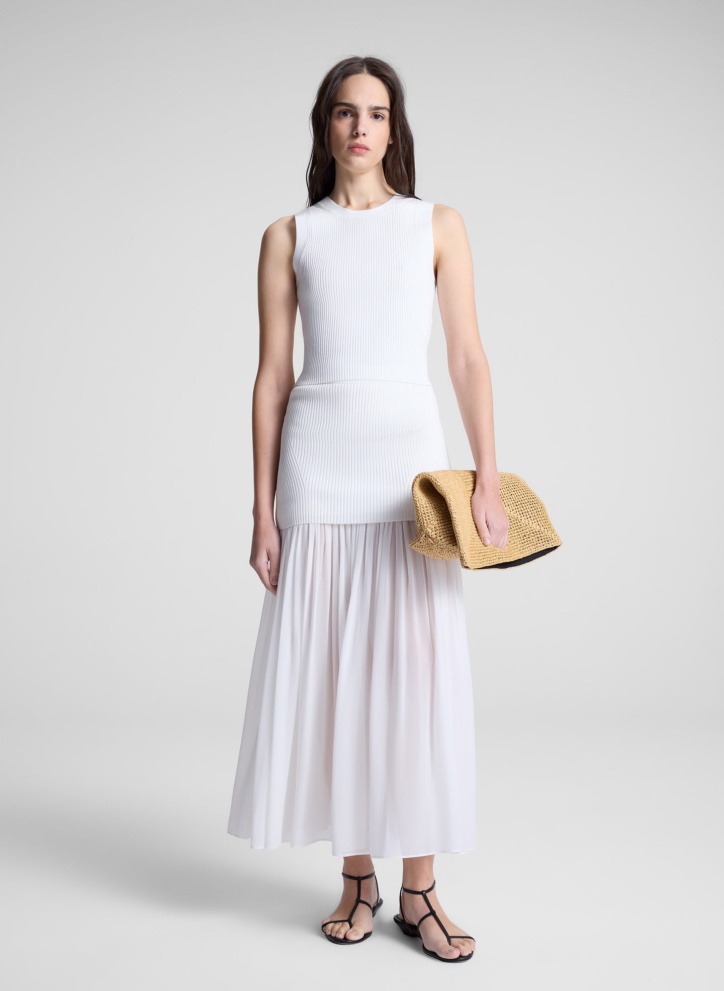 woman wearing white top and matching maxi skirt