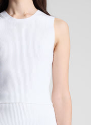 woman wearing white tank top and matching skirt