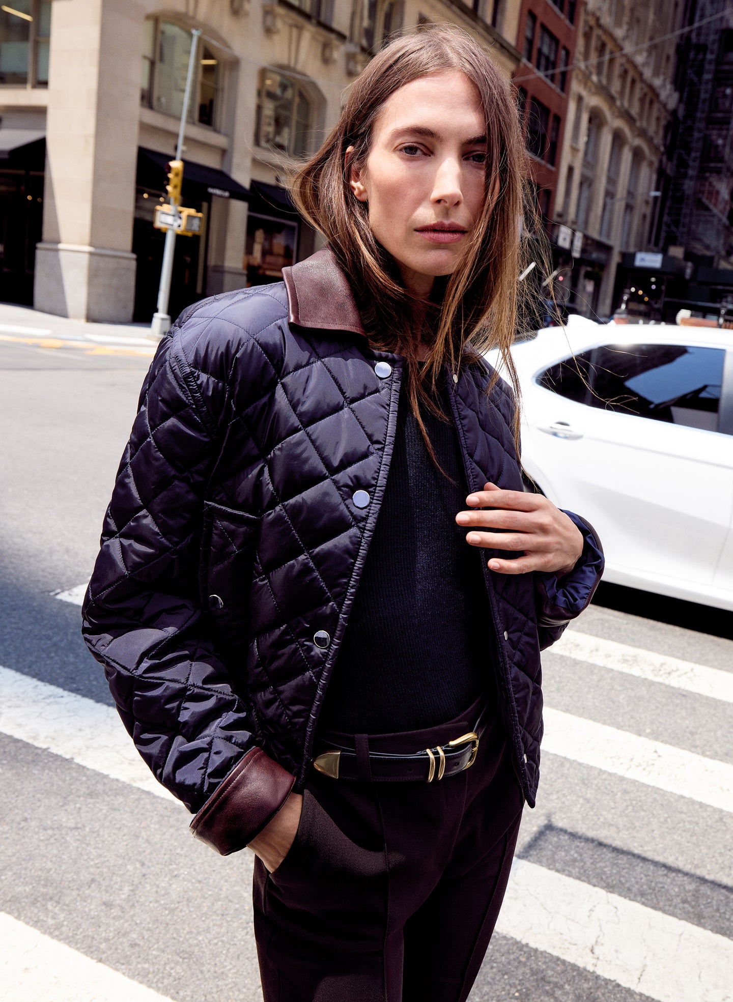 woman wearing navy blue quilted jacket