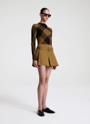 woman wearing plaid print fine gauge voile knit top