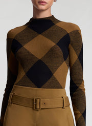 woman wearing plaid print fine gauge voile knit top