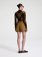 woman wearing plaid print fine gauge voile knit top