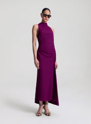 Woman wearing a purple dress on a white background