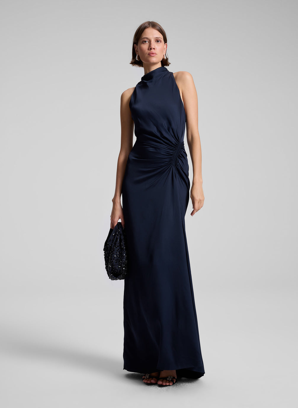 woman wearing navy blue sleeveless gown