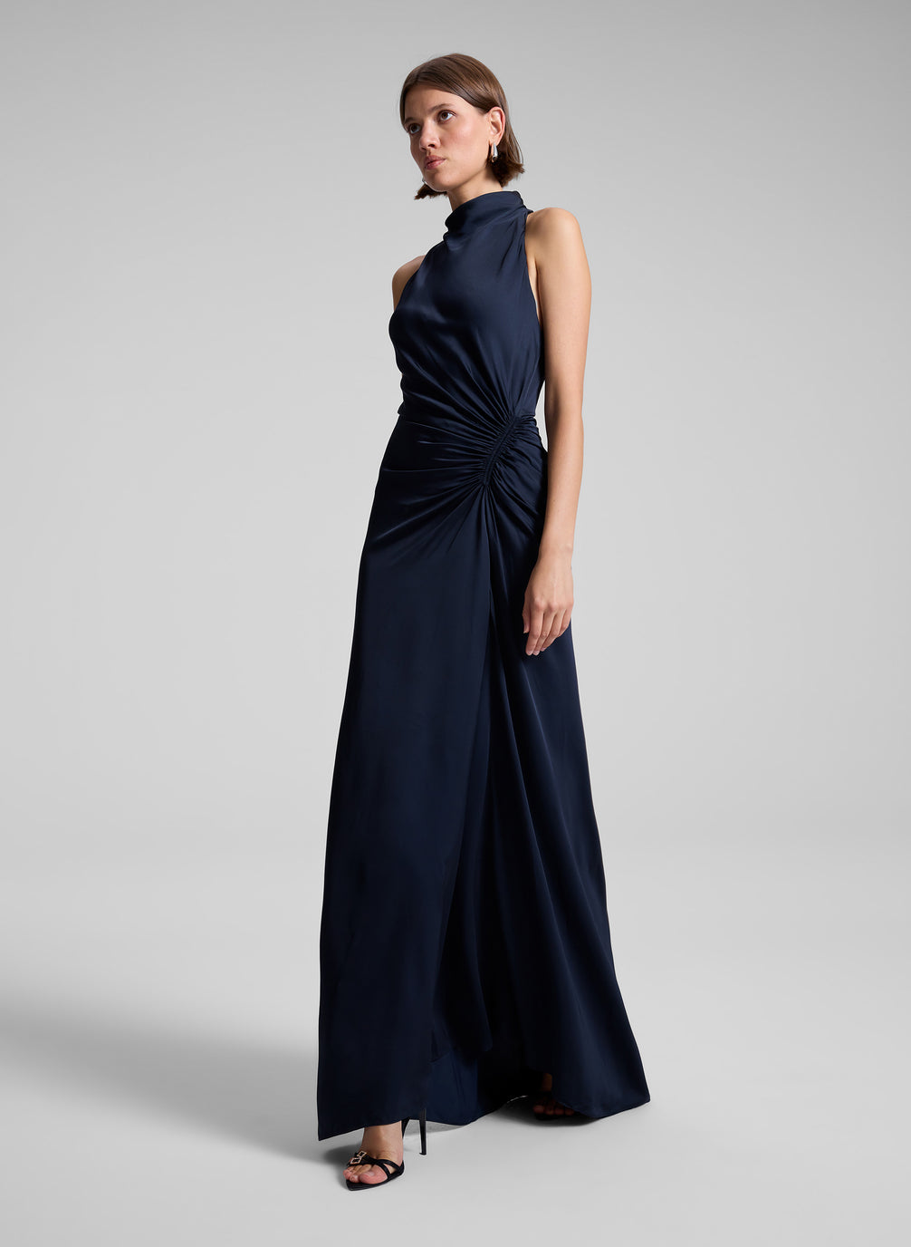 woman wearing navy blue sleeveless gown