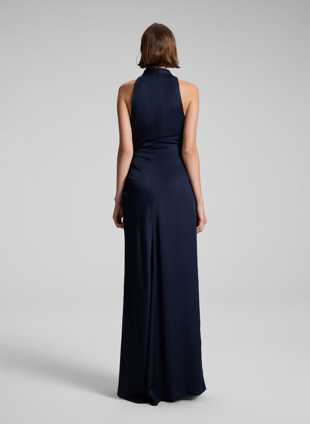 woman wearing navy blue sleeveless gown