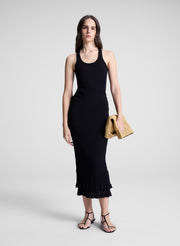 woman holding raffia handbag