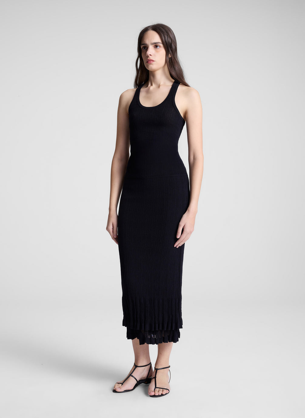 woman wearing black tank top and black midi skirt