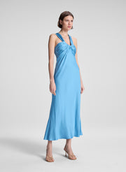 woman wearing blue satin midi dress