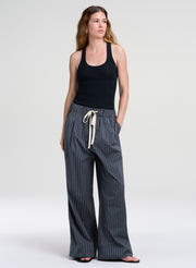 woman wearing green tank top and striped pants