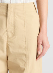 woman wearing white shirt and beige pants